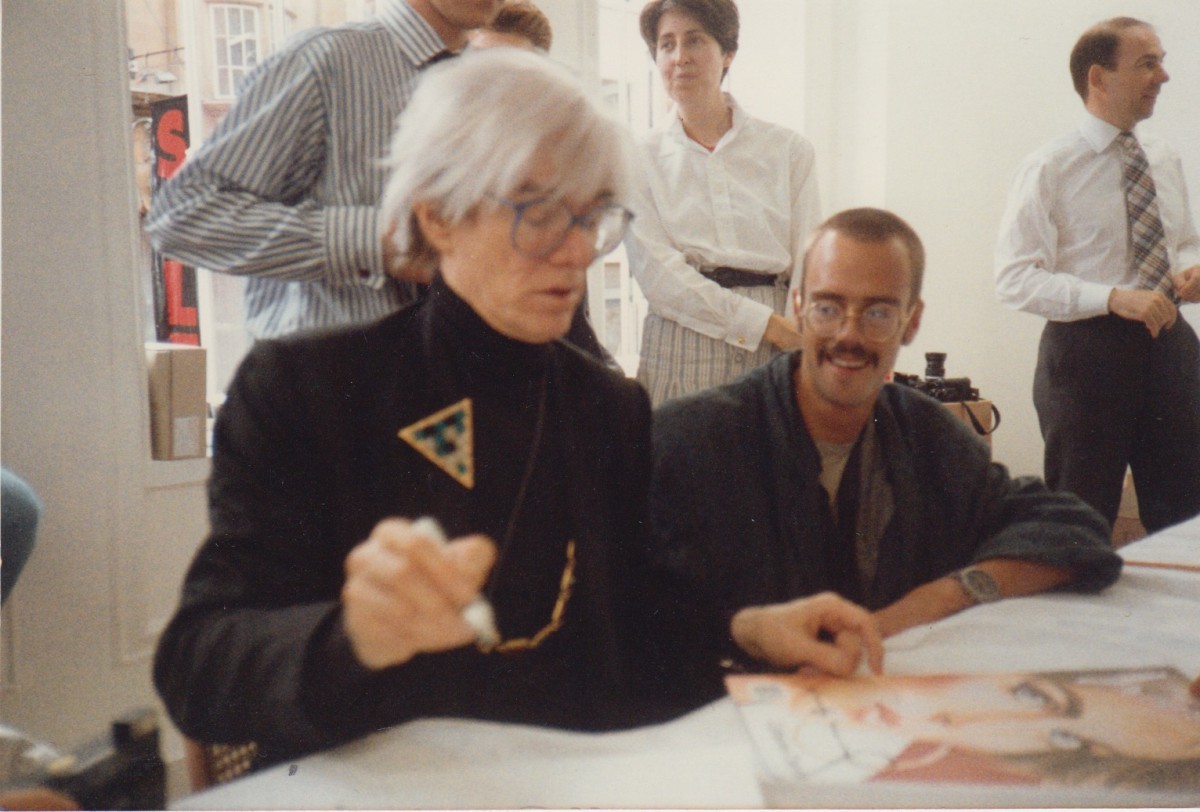ANDY WARHOL SIGNING WITH THE SON OF BEUYS, WENZEL