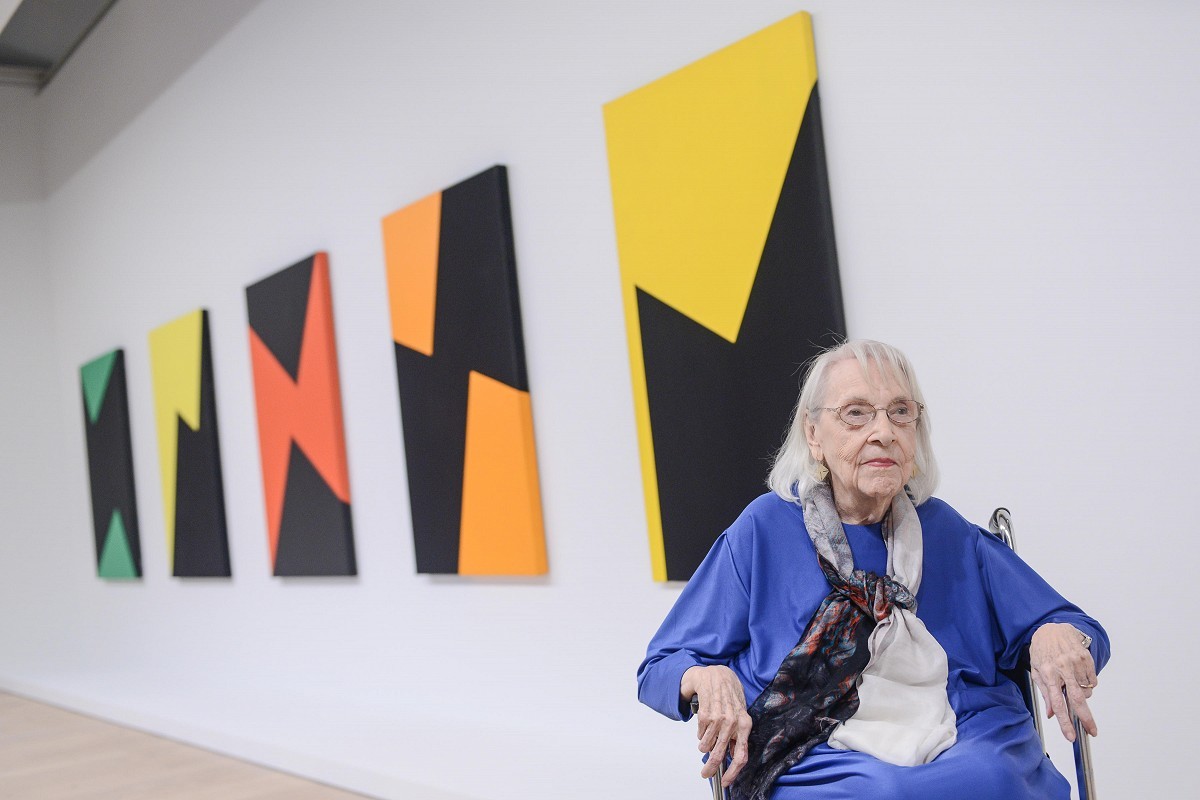 CARMEN HERRERA WITH HER PAINTINGS, 101 YEAR OLD