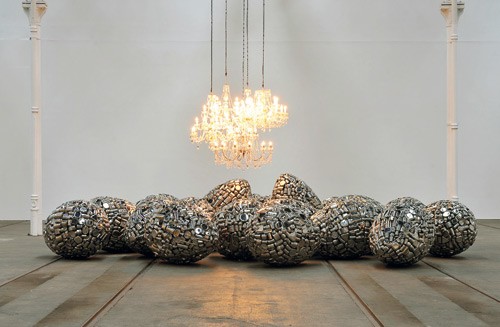 INCUBATE, 2010, 25 STAINLESS STEEL EGGS, 5 CHANDELIERS, VARIABLE DIMENSIONS INSTALLATION VIEW SUBODH GUPTA.TAKE OFF YOUR SHOES AND WASH YOUR HANDS, TRAMWAY, GLASGOW, SCOTLAND, 2010, © SUBODH GUPTA COURTESY THE ARTIST AND HAUSER &amp; WIRTH, PHOTO: ALAN DIMMICK